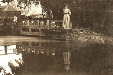 Wootton Wawen.  Lady on bridge
