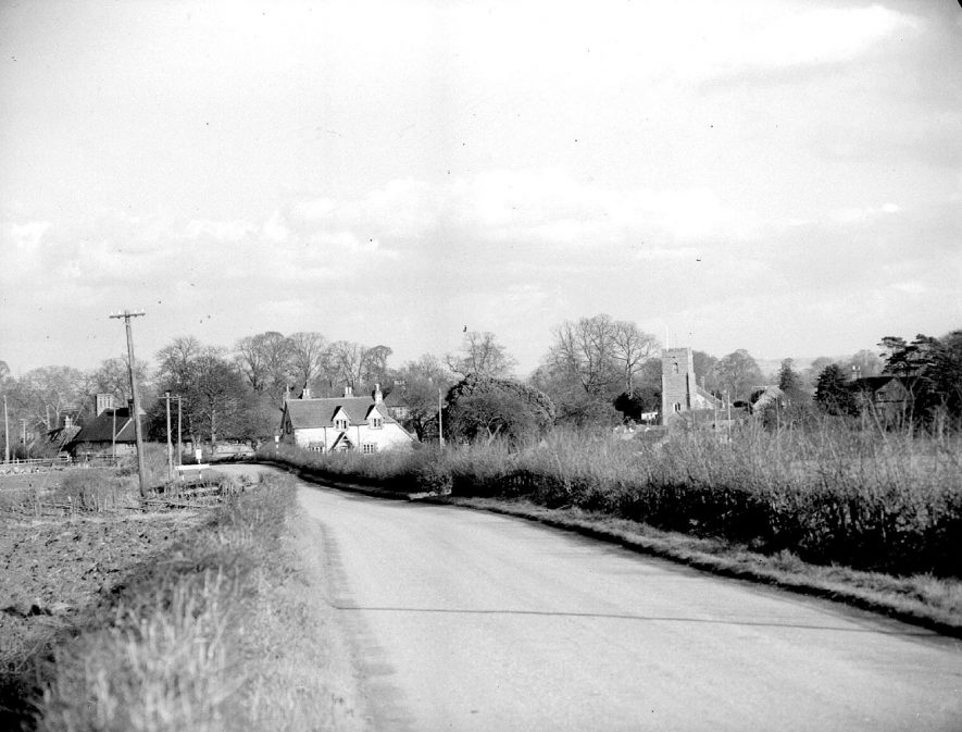 St Peter & Paul church and cottage, Butlers Marston. It has suggested that the building in the foreground described as 'cottage' is in fact the Old School House and School. This has been recently renovated and converted into one property. February 16th 1957 |  IMAGE LOCATION: (Warwickshire County Record Office)