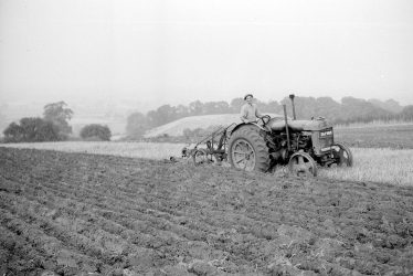 Burton Dassett.  Farmworker ploughing the hills