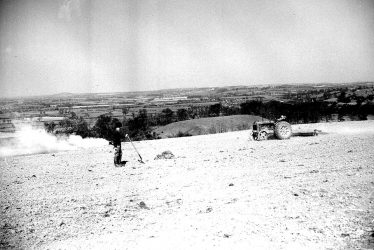 Burton Dassett.  Farmworker harrowing on the hills