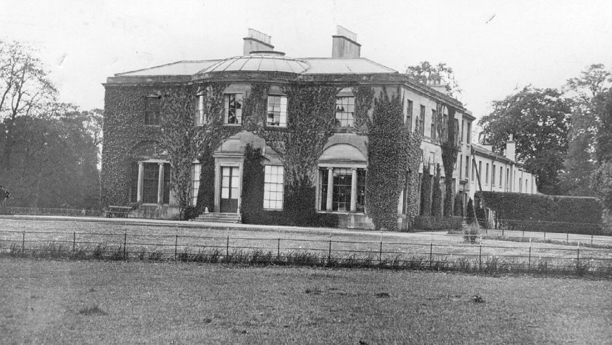 Coton House, Churchover, front elevation and part of garden. 1900s[The house was built by Abraham Grimes who succeeded to the Lordship of the Manor about 1787,on the site of a previous house which was in the Tudor style and which was demolished in 1784. From the Grimes family it passed to the Arkwrights in 1870 and then in 1889 to Mr Arthur James whose widow was the last private owner. Mr Arthur James died in London on 2nd May 1948 and in August 1948 the property was bought by the BTH Co. Ltd. for use as a student and apprentice hostel between 1948 and 1968. The Manorial rights date back to before the Conquest. A history of the Manor can be seen in the Victoria County History of Warwickshire. Vol.6 p.63.] |  IMAGE LOCATION: (Warwickshire County Record Office)