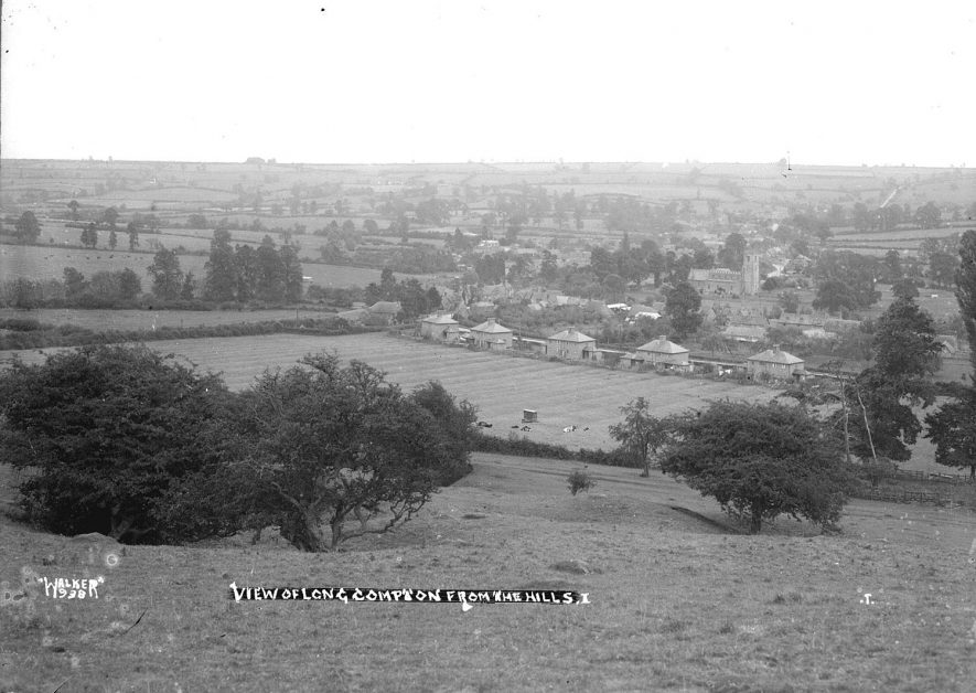 A view of Long Compton from the hills.  1930s |  IMAGE LOCATION: (Warwickshire County Record Office)