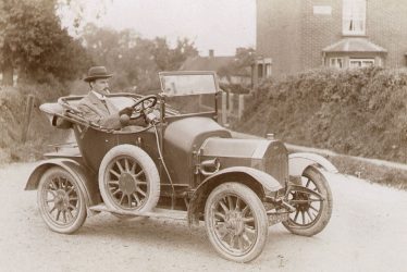 Beaudesert.  Mr Parkes in car at Buckley Green