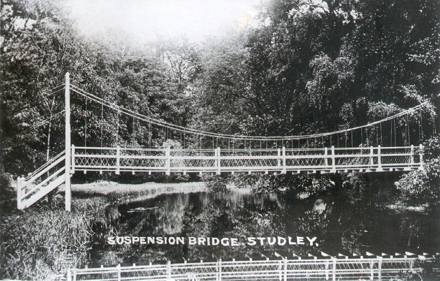 Suspension bridge over the lake at Studley Castle  1900s |  IMAGE LOCATION: (Warwickshire County Record Office)