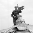 Chesterton.  Repairing the windmill weather vane