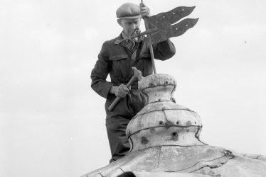 Chesterton.  Repairing the windmill weather vane