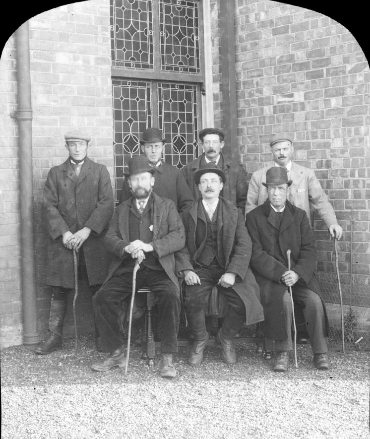 Group of bellringers on Boxing Day at Clifford Chambers. Back row, left to right - John Salmon, William Radbourne, Clerk Lively, John Betteridge. Front row - Will Lively, Enoch Lively, George Lines.  1901 |  IMAGE LOCATION: (Warwickshire County Record Office) PEOPLE IN PHOTO: Salmon, John, Salmon as surname, Radbourne, William, Radbourne as a surname, Lively, Will, Lively, Enoch, Lively, Clerk, Lively as a surname, Lines, George, Lines as a surname, Betteridge, John, Betteridge as a surname