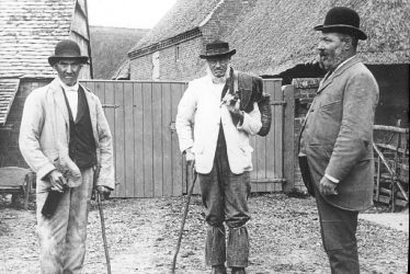 Clifford Chambers.  Men in a farmyard