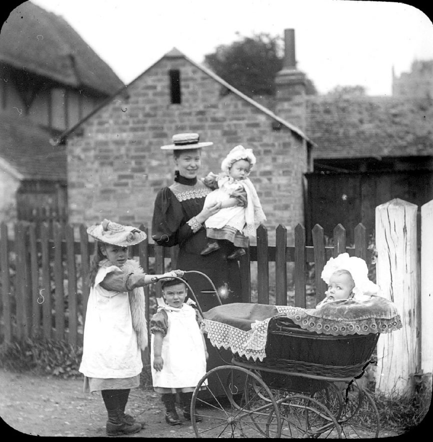 Lady with four children, one in a perambulator. Clifford Chambers.  1900s |  IMAGE LOCATION: (Warwickshire County Record Office)