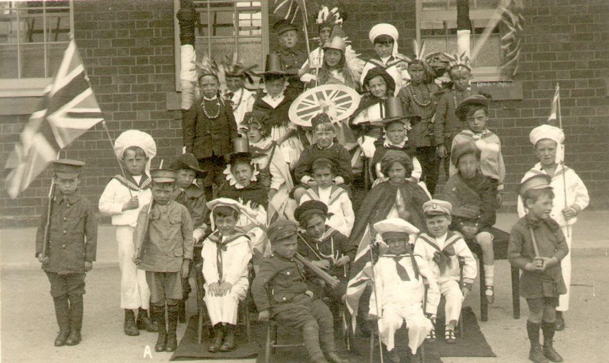 Group photograph of Studley Council School infants in costume for Empire Day celebrations.  1920s |  IMAGE LOCATION: (Warwickshire County Record Office)
