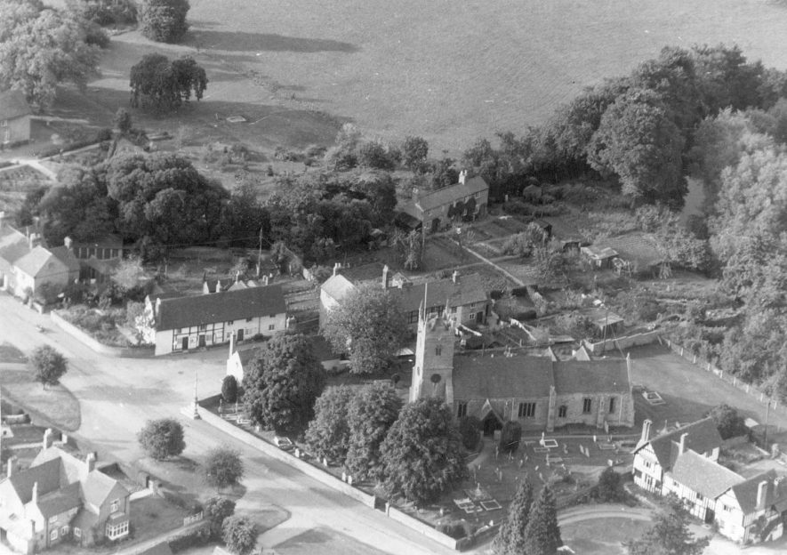 Aerial view of St Helen's church, Clifford Chambers. The churchyard had become so full that part of the rectory orchard has been taken for this purpose.  1950s |  IMAGE LOCATION: (Warwickshire County Record Office)