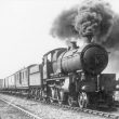 Fenny Compton.  Steam train passing through the station