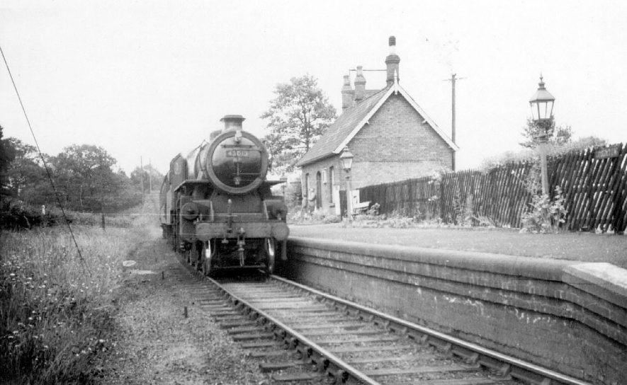 Coughton Station with L.M.S. standing stationary, drawn by engine No.43013  . 2-6-0. The Ashchurch to Birmingham train.  1952 |  IMAGE LOCATION: (Warwickshire County Record Office)