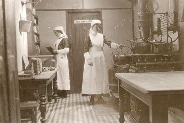 Henley in Arden.  Red Cross Hospital nurses in ward kitchen
