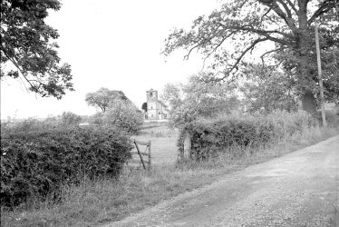 Marton.  View across fields to St Esprit's Church
