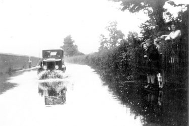 Warwick.  Car in Floods