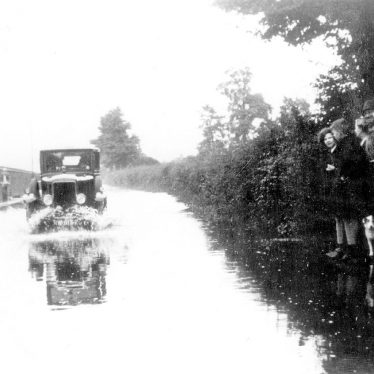 Warwick.  Car in Floods