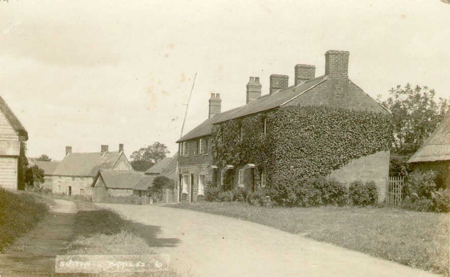 The village street in Sutton under Brailes.  1920s
 |  IMAGE LOCATION: (Warwickshire County Record Office)
