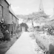 Shotteswell.  Cottages and church spire