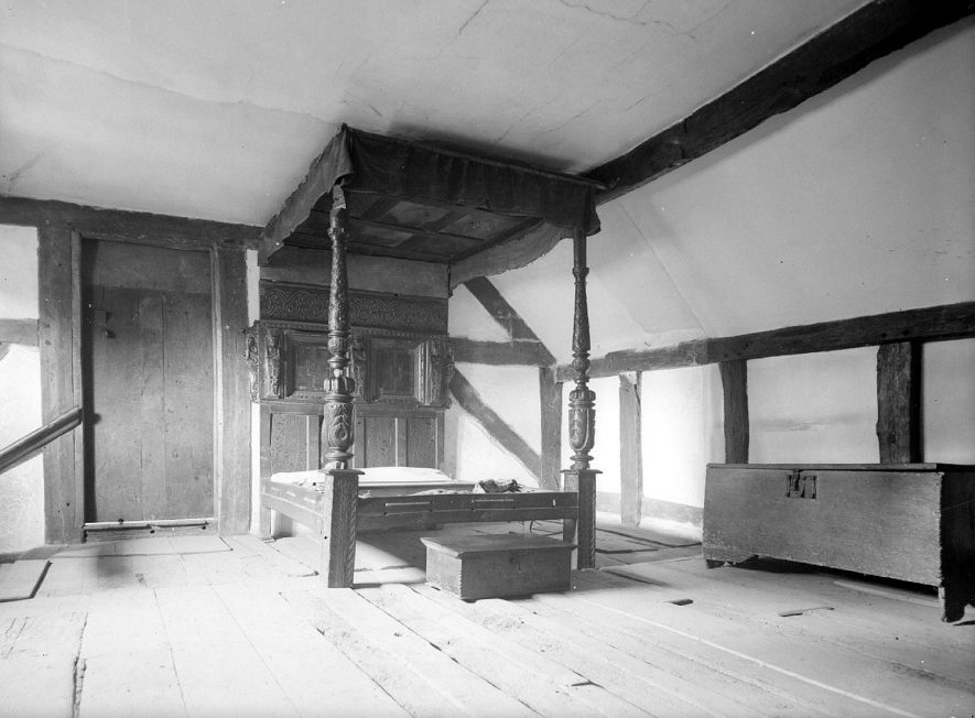 Anne Hathaway's cottage in Shottery, showing bedroom with carved bedstead.  September 1946 |  IMAGE LOCATION: (Warwickshire County Record Office)