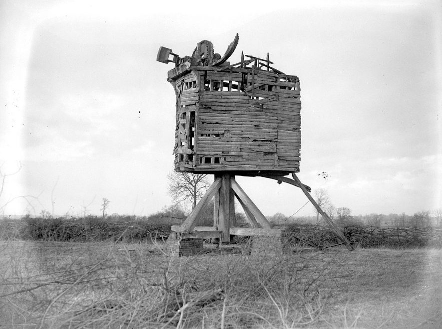 Disused wooden post windmill, formerly called 'Pinchem', Shrewley. 1929Originally built in Claverdon 1803, but moved to Shrewley Common in 1832. Open trestle, 4 common sails, iron sheeted roof, wooden machinery, one pair stones, ladder and tailpole. Last worked c.1880. Sails blew off c.1895. Collapsed 1937. Main post sold and wreckage cleared c.1941. |  IMAGE LOCATION: (Warwickshire County Record Office)