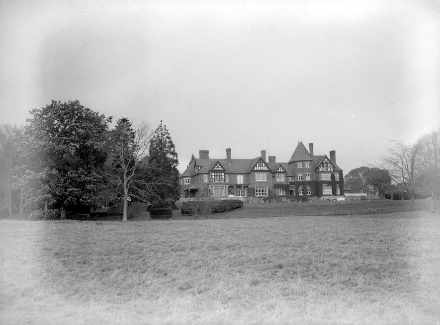 Temple Grafton Court, front exterior.  1931
[The Court is actually on the site of an older stately moated house that was burnt down. Signs of the moat can still be seen in the gardens. When the new Court was built the owners had the bell tower removed from the neighbouring Court Farm as it spoiled the views from the Court. The bell is now situated on the west side of the old servants quarters of Court Farm. The Court was also used for some time as a hotel but has now been seperated into apartments and sold off as flats.] |  IMAGE LOCATION: (Warwickshire County Record Office)