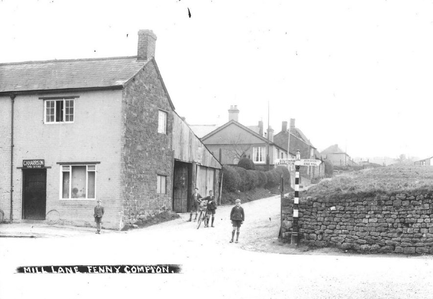Part of village, Mill Lane, showing housing and butcher's shop, Fenny Compton.  1930s |  IMAGE LOCATION: (Warwickshire County Record Office)