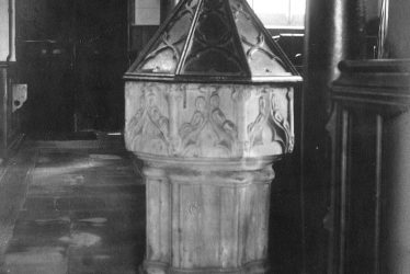 Wolston.  Church, font