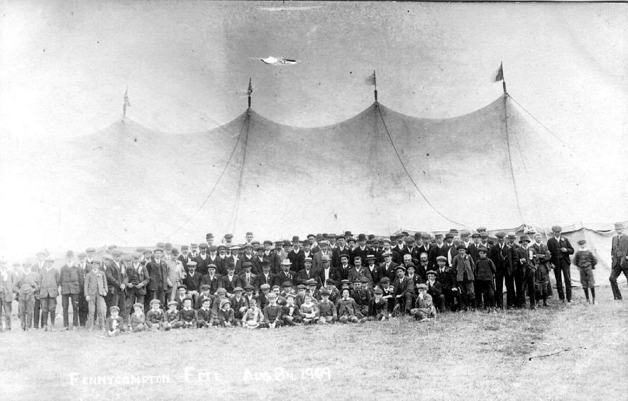 A large crowd of people outside a marquee at a fete, Fenny Compton.  1909 |  IMAGE LOCATION: (Warwickshire County Record Office)