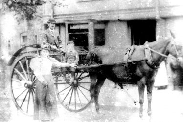 Warwick.  Family in horse drawn carriage