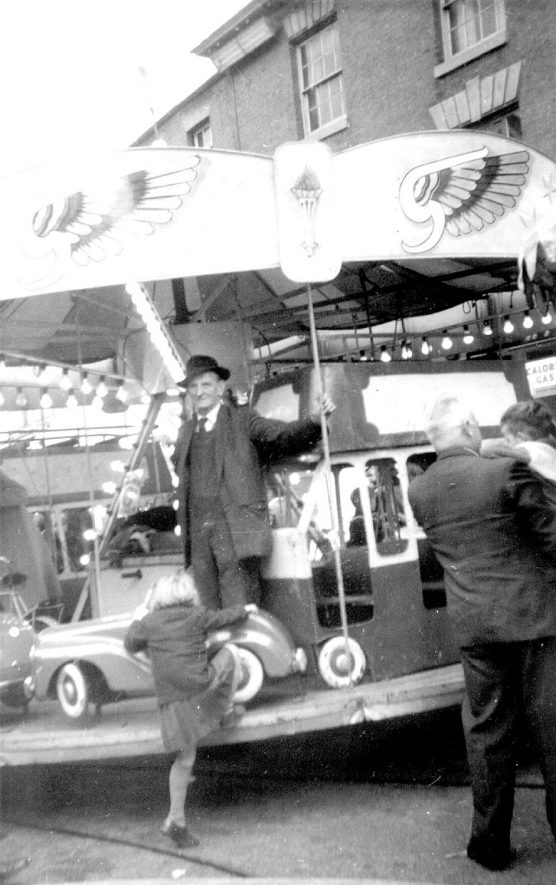 Merry go round at the Mop fair, Warwick. 1960s |  IMAGE LOCATION: (Warwickshire County Record Office)