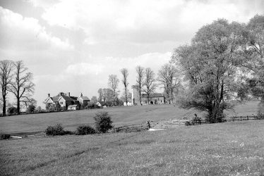 Whatcote. View over meadows towards church