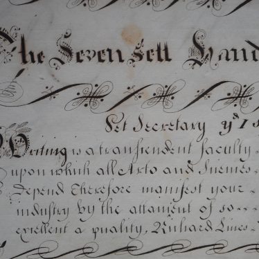 'The Seven Sett Hands' - an example of penmanship that reads 'writing is a transcendent faculty', surrounded by flourishes. | Warwickshire County Record Office reference CR2539