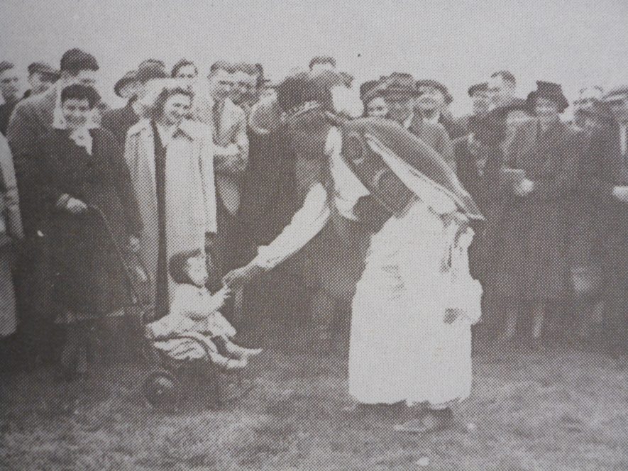 Ras Prince Monolulu entertains the crowd at Warwick Racecourse. Image from 'Bygone Warwickshire: A Photo History of our County', Leamington Spa Courier. | Warwickshire County Record Office reference PH557/page 20