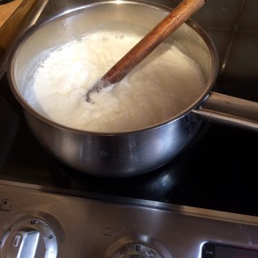 Dissolving the bicarbonate of soda in the boiling milk. | Image courtesy of Clare Murdoch