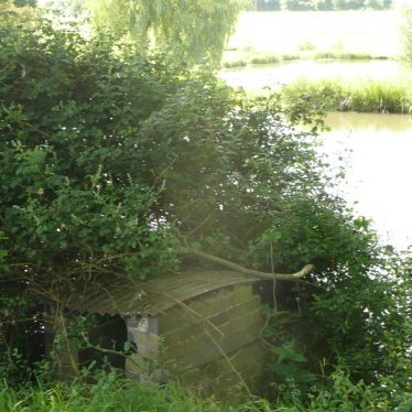 Water wheel located between the 1st and 2nd of the 3 fishpools at Newnham Hall. It appears to be relatively recent and resembles a turbine. Perhaps it was part of an early 20th century electricity generating system? | Image courtesy of William Arnold