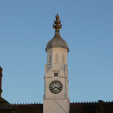 Close up of white clock tower on top of central almshouse | Image courtesy of William Arnold