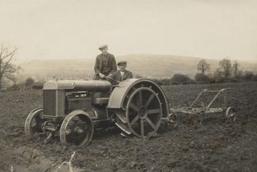 Long Compton. A Tractor and Plough in a Field at Yerdley Farm