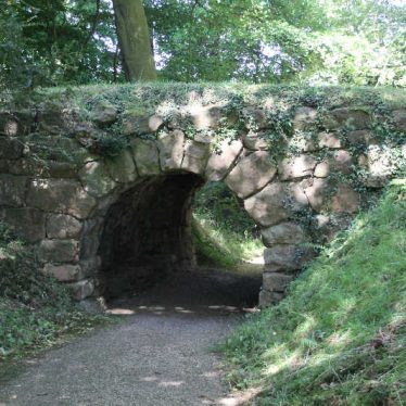 Arbury Hall grounds, 2017. An arched bridge across a path. | Image courtesy of Nuneaton Memories
