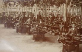 The Machine Shop (Grinders) at the Humber Works, presumably at the then new Stoke plant. 1900s. A bunch of men freeze for the camera surrounded by their machinery. | Warwickshire County Record Office reference PH352/65/61