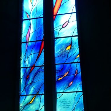Millenium Window, St Gregory's, offchurch, 2018. Blue stained glass is interrupted with other coloured 'flowers' within the window. | Image courtesy of Caroline Irwin