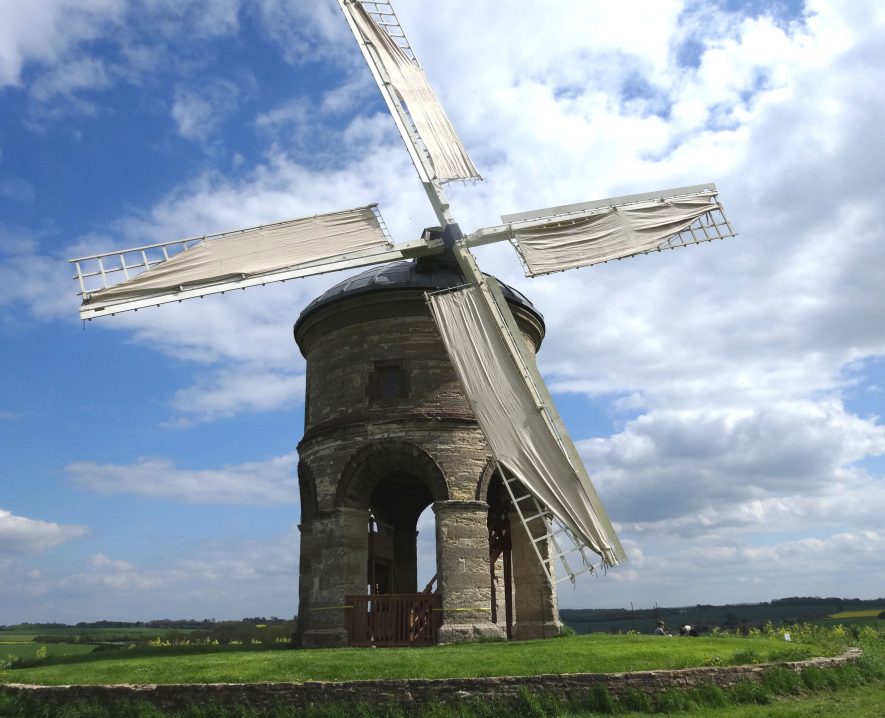 Chesterton Windmill. The sails are on, and there is a blue sky background, with clouds. | Image courtesy of Heritage & Culture Warwickshire