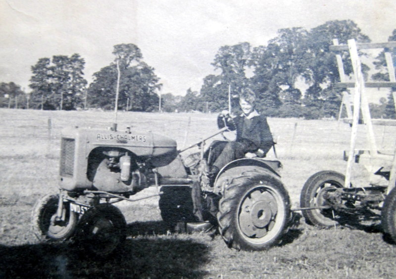 Bidford on Avon. Sam Lynes on the Allis Chalmers tractor at Bickmarsh Hall Farm, 1940s. | Image courtesy of Joan Broscomb