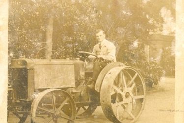 Wroxall. Leonard Bolton Driving an Austin Tractor at Wroxhall Abbey