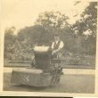 Wroxall. Gardener Using Large Petrol Powered Lawn Mower, Wroxhall Abbey