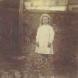 Ladbroke.  Child outside Church Cottages.