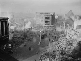 Broadgate in Coventry city centre following the Coventry Blitz of 14/15 November 1940. The burnt out shell of the Owen Owen department store (which had only opened in 1937) overlooks a scene of devastation. | Image taken by Taylor (Lt) - War Office official photographer, courtesy of Imperial War Museum. H5600 Imperial War Museum Archives