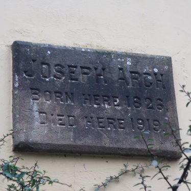 Stone plaque on the wall of Joseph Arch's former home in Barford. Memorial plaque on the house where Joseph Arch was born and died | Image courtesy of Gary Stocker