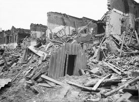 Black and white photo of an Anderson shelter surviving after a raid in London during World War Two | Image courtesy of Imperial War Museum, Ref: D5949