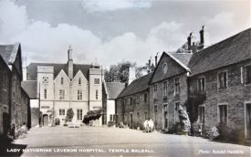 Lady Katherine Leveson Hospital Master's House & Courtyard with 2 residents, pre 1964. Black & White Real post-card. | Warwickshire County Record Office reference PH 66/83